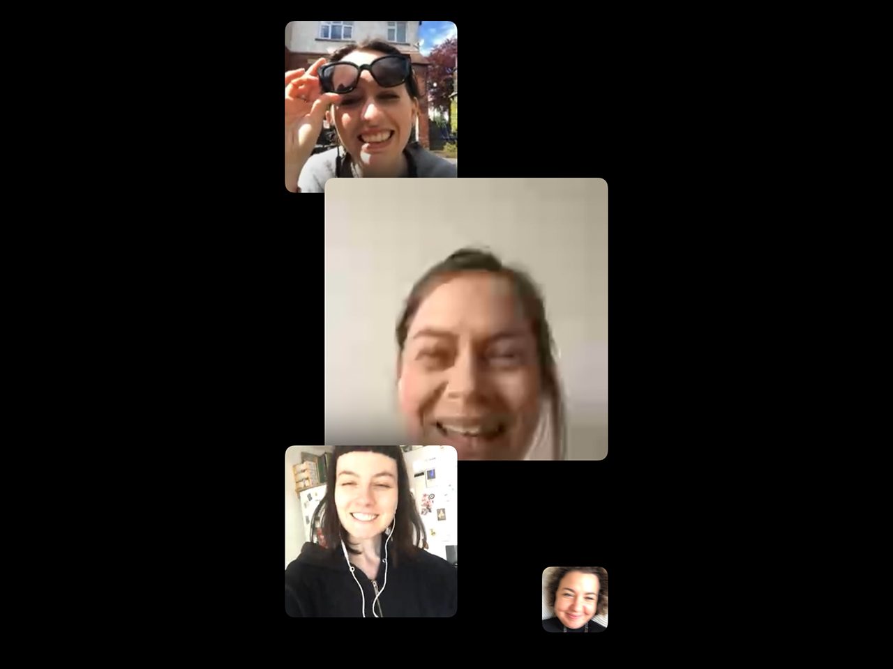 A screenshot of a FaceTime video call with four women smiling