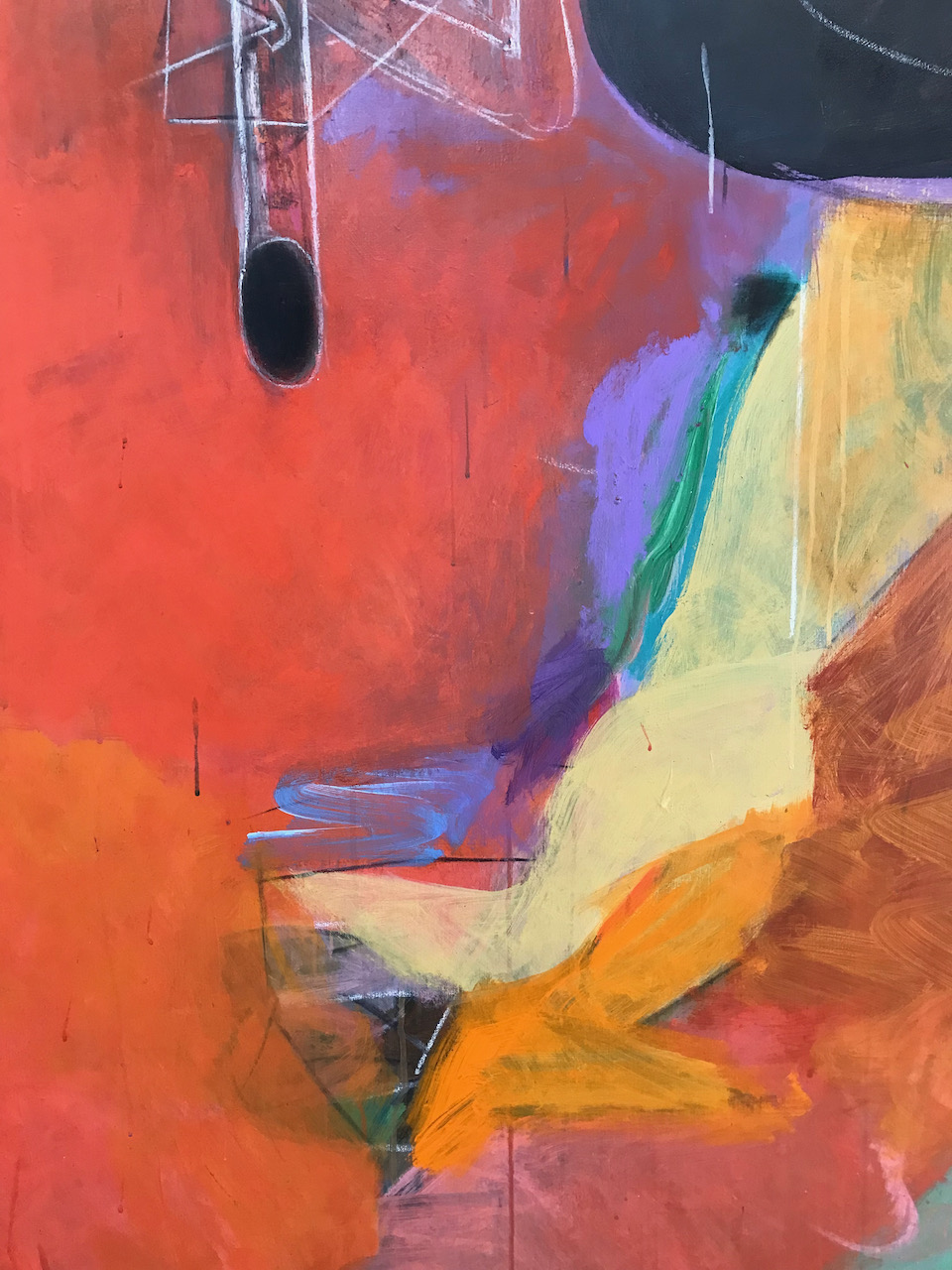 A close-up of one of Pomar's paintings – abstract and gestural, in warm colours.