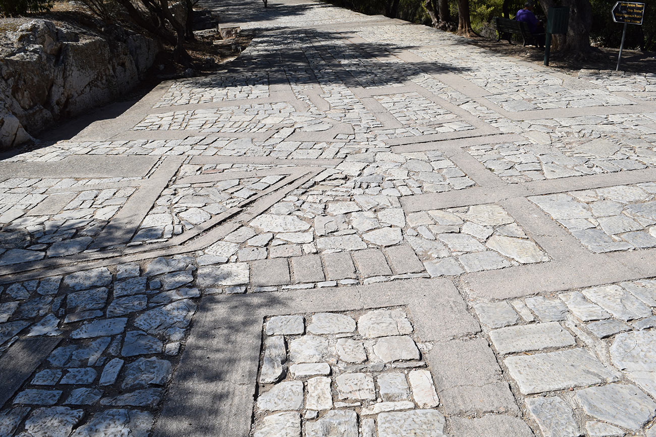 A photo of the gestural concrete forms amongst the stone pathway.