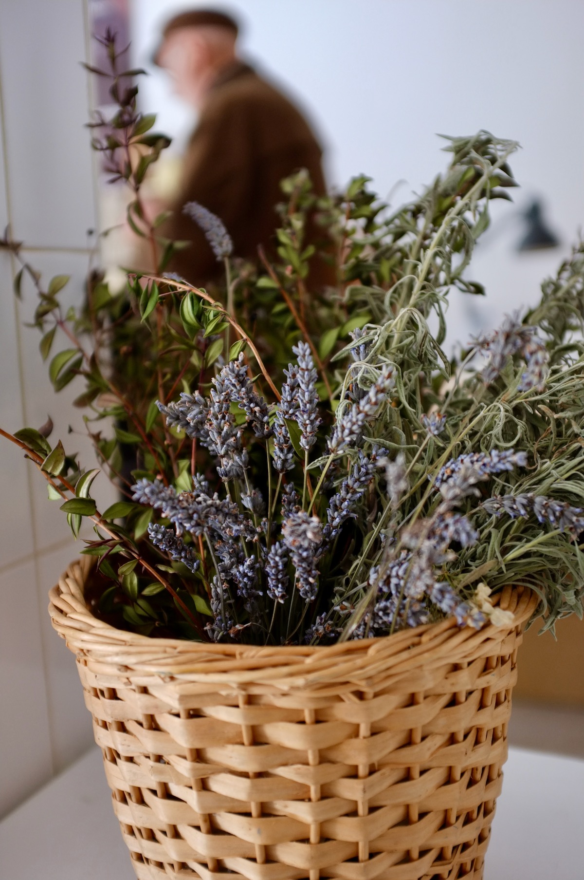 A woven basket full of dried lavender.