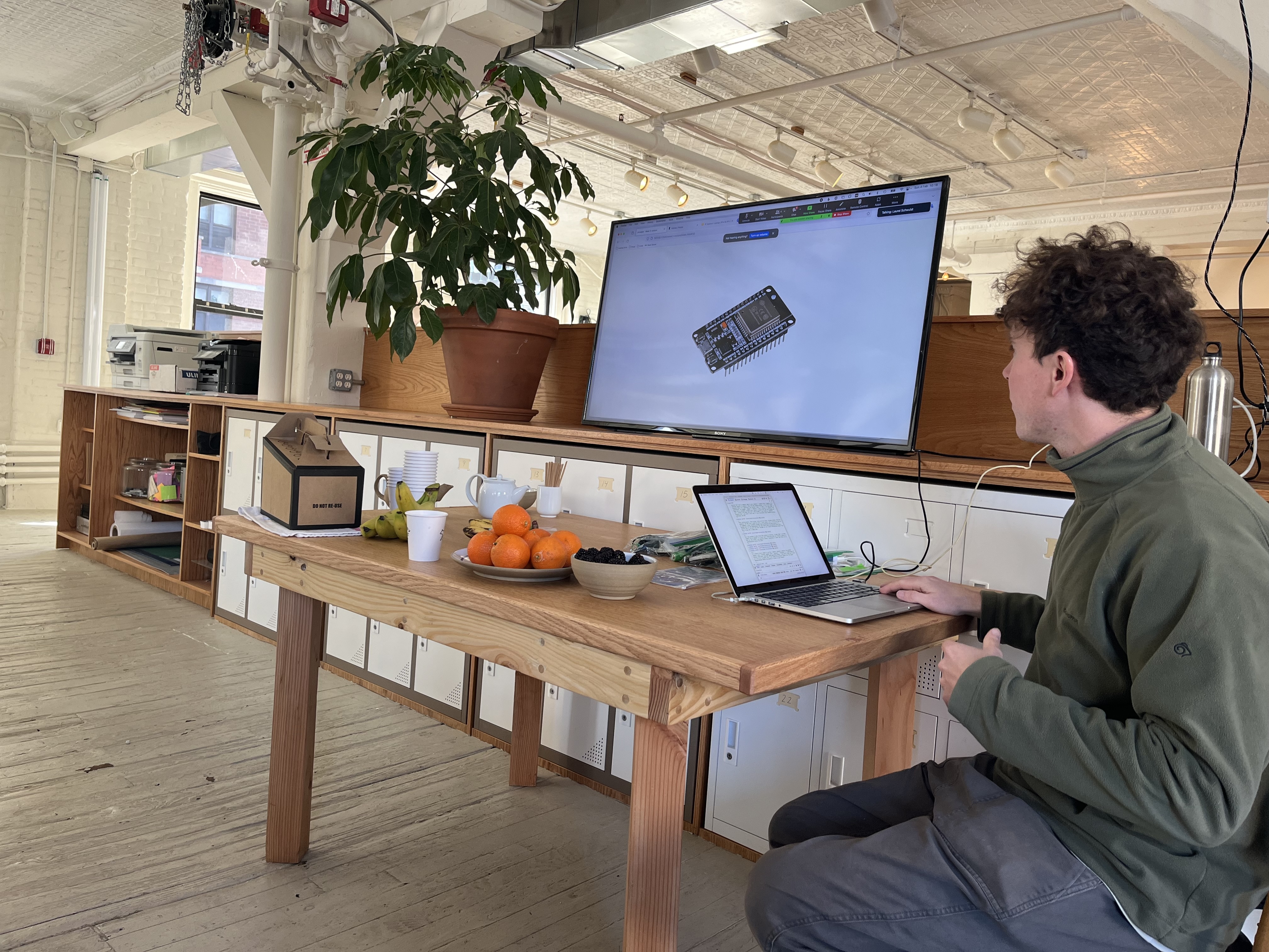 Ben going through a presentation with an ESP module on the screen beside him