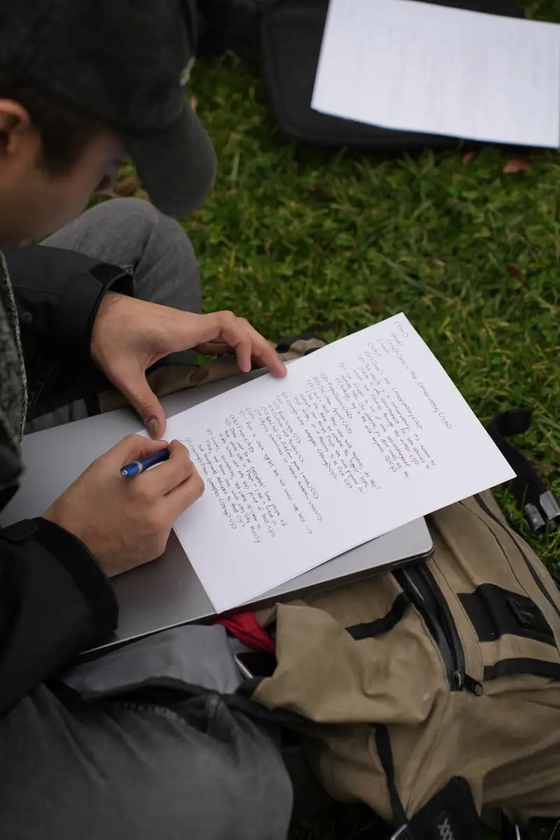 omar writing html on paper